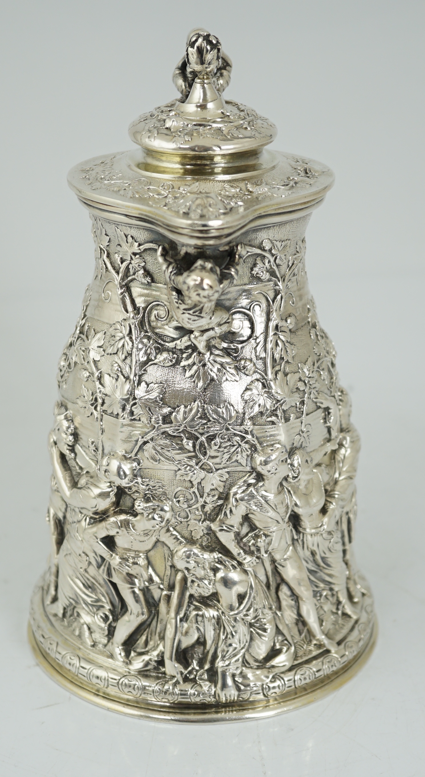 ROYAL INTEREST: A good ornate Victorian Teniers style silver ewer with hinged cover by Frederick Elkington